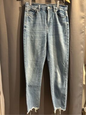 AE light wash high rise denim with distressed hem.  Size 4